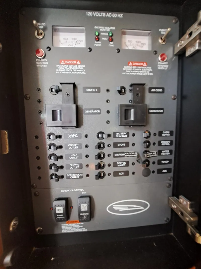 Slide: The Image of Electrical control panel of a 2005 Chaparral 330 Signature Cruiser boat. - 12