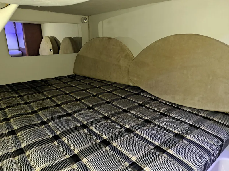 Slide: The Image of Interior cabin bed of 2005 Chaparral 330 Signature Cruiser with plaid bedding. - 16