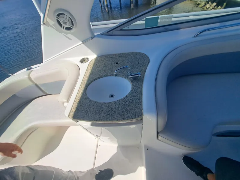 Slide: The Image of 2005 Chaparral 330 Signature Cruiser cockpit with sink and seating area. - 8