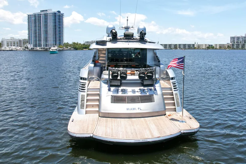 Slide: The Image of 2007 Pershing 90 yacht docked in Miami, FL with American flag. - 16