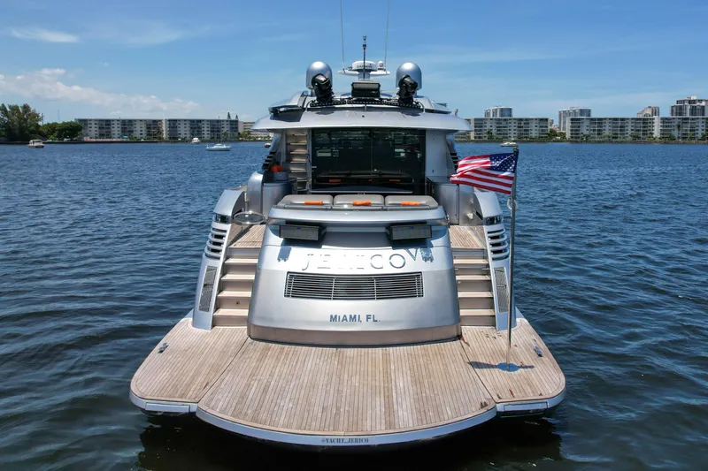Slide: The Image of 2007 Pershing 90 yacht docked in Miami, rear view with American flag. - 17