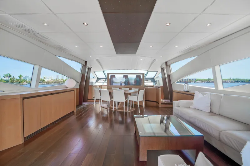 Slide: The Image of Luxurious interior of a 2007 Pershing 90 yacht with modern furnishings and panoramic windows. - 23