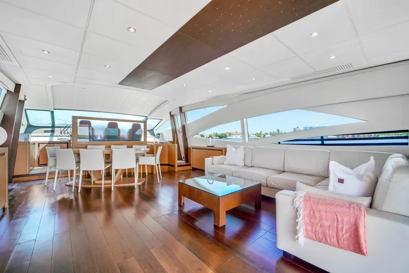 Slide: The Image of Luxurious interior of a 2007 Pershing 90 yacht with modern furnishings and large windows. - 25
