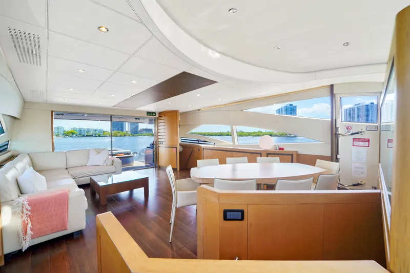 Slide: The Image of Luxurious interior of a 2007 Pershing 90 yacht with modern furnishings and panoramic windows. - 29