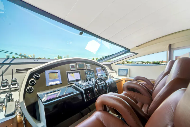 Slide: The Image of Luxurious helm of a 2007 Pershing 90 yacht with advanced navigation systems. - 33