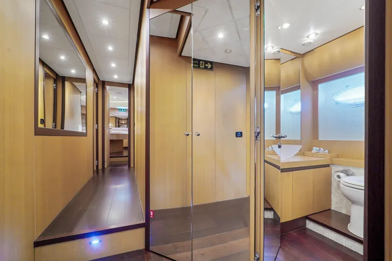 Slide: The Image of Luxurious interior of a 2007 Pershing 90 yacht with modern bathroom and hallway. - 36