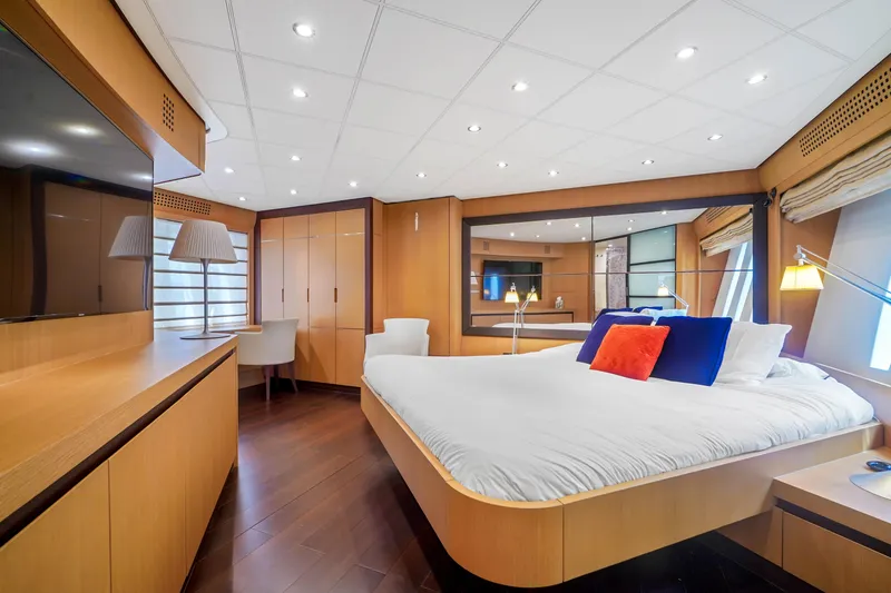 Slide: The Image of Luxurious bedroom interior of 2007 Pershing 90 yacht with modern furnishings and ample lighting. - 39