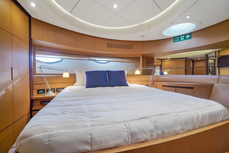 Slide: The Image of Luxurious bedroom interior of 2007 Pershing 90 yacht with modern lighting and cozy bedding. - 42