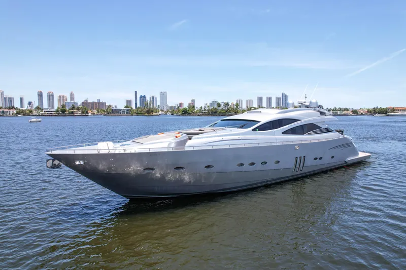 Slide: The Image of 2007 Pershing 90 yacht on calm water with city skyline background. - 5