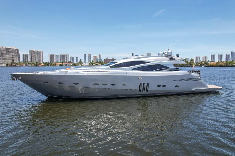 Slide: The Image of 2007 Pershing 90 yacht on calm water with city skyline background. - 6