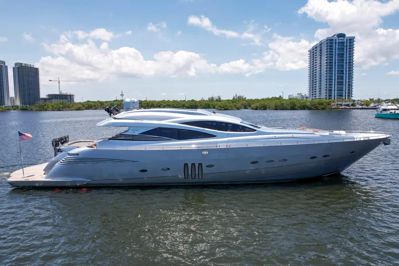 Slide: The Image of 2007 Pershing 90 yacht on water with cityscape background. - 7
