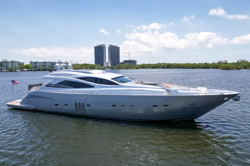 Slide: The Image of 2007 Pershing 90 yacht on calm water with cityscape background. - 8