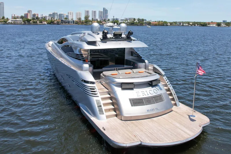 Slide: The Image of 2007 Pershing 90 yacht on water with city skyline in background. - 9