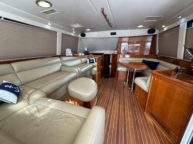 Slide: The Image of Luxurious interior of 2003 Riviera 48 yacht with leather seating and wooden finishes. - 12