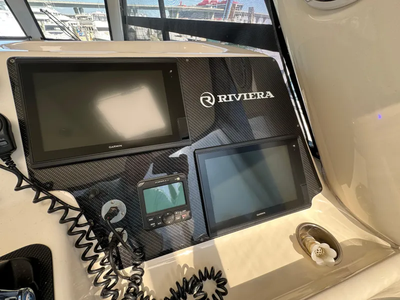Slide: The Image of Riviera 48 yacht dashboard with navigation screens, 2003 model. - 26