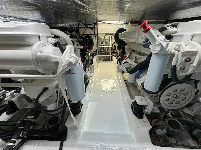 Slide: The Image of Engine room of 2003 Riviera 48 yacht, showcasing mechanical components and systems. - 30