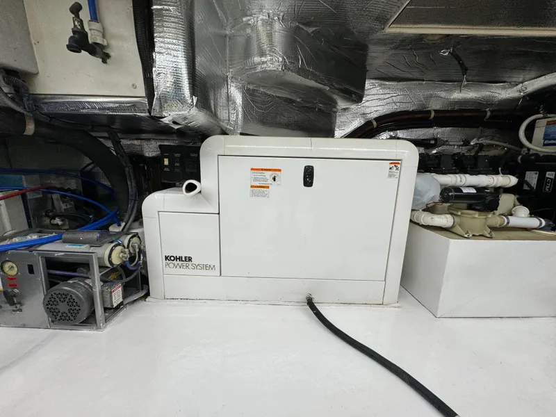 Slide: The Image of Kohler power system in 2003 Riviera 48 yacht engine room. - 33