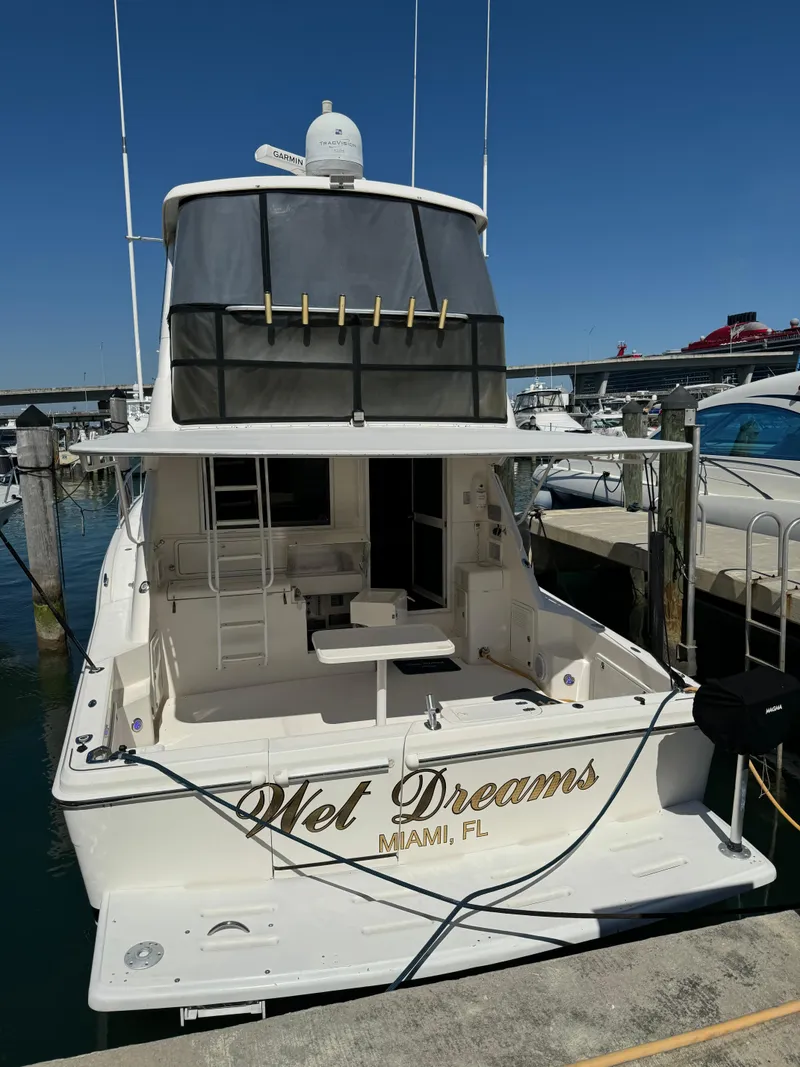 Slide: The Image of Riviera 48 yacht, 2003 model, docked in Miami marina. - 9