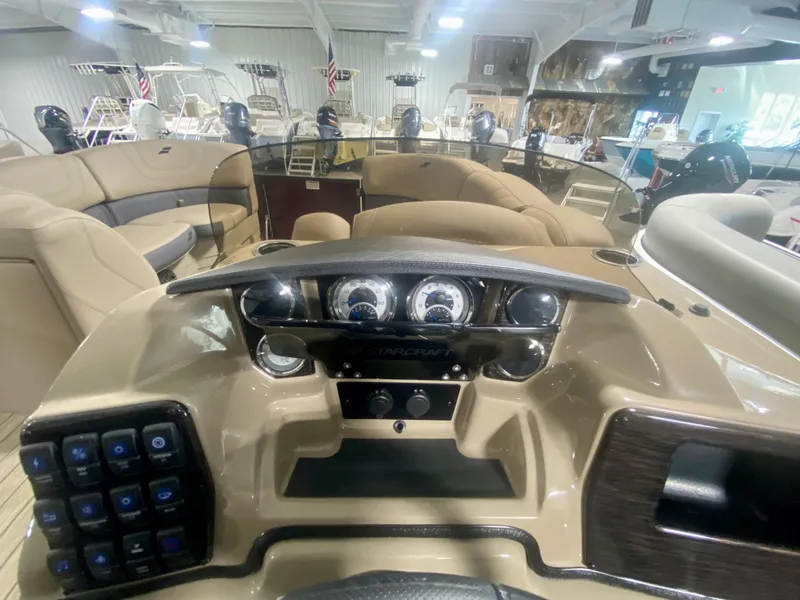 Slide: The Image of 2024 Starcraft SLS 3 Q DH boat dashboard with modern controls and gauges. - 18