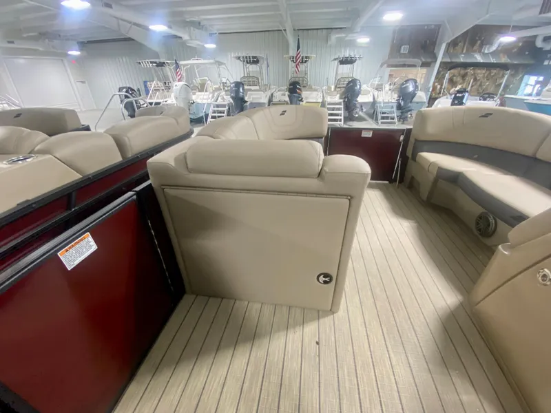 Slide: The Image of 2024 Starcraft SLS 3 Q DH boat interior with beige seating and wood flooring. - 23