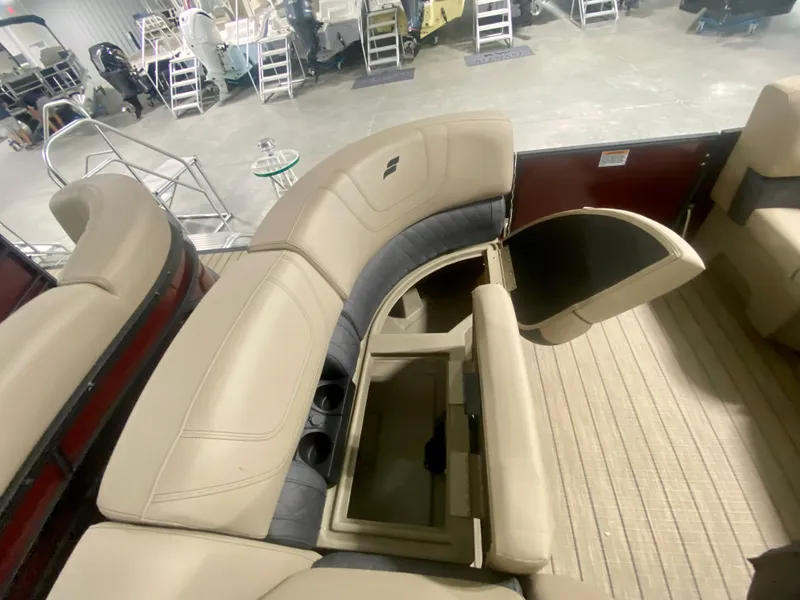 Slide: The Image of 2024 Starcraft SLS 3 Q DH boat interior with beige seating and storage compartments. - 28
