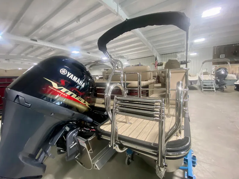 Slide: The Image of 2024 Starcraft SLS 3 Q DH pontoon boat with Yamaha outboard motor in showroom. - 4