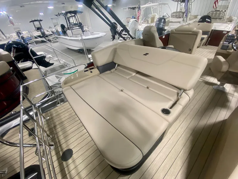 Slide: The Image of 2024 Starcraft SLS 3 Q DH boat interior with beige seating and wooden flooring. - 11