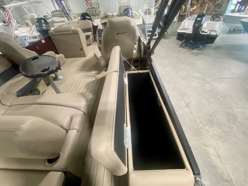 Slide: The Image of 2024 Starcraft SLS 3 Q DH boat interior with open storage compartment. - 13