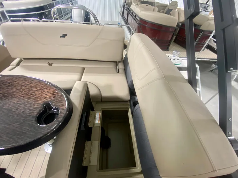 Slide: The Image of 2024 Starcraft SLS 3 Q DH boat interior with beige seating and storage compartment. - 15