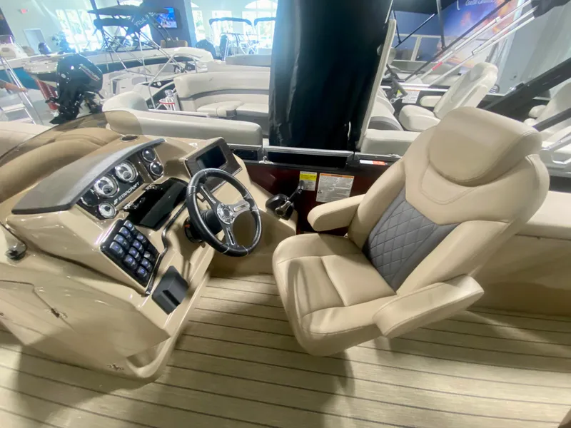 Slide: The Image of 2024 Starcraft SLS 3 Q DH boat interior with captain's chair and control panel. - 16
