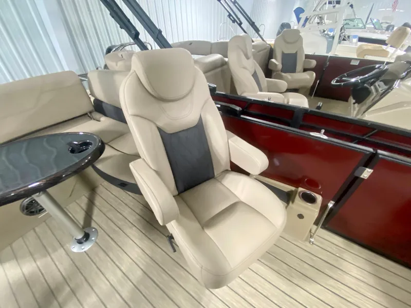 Slide: The Image of 2024 Starcraft SLS 3 Q DH boat interior with beige seating and wood flooring. - 19