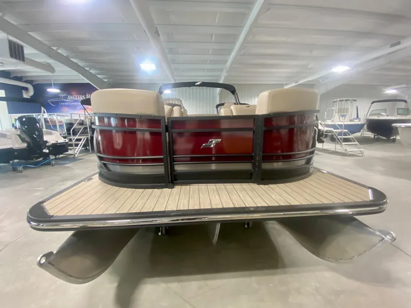 Slide: The Image of 2024 Starcraft SLS 3 Q DH pontoon boat in showroom. - 2