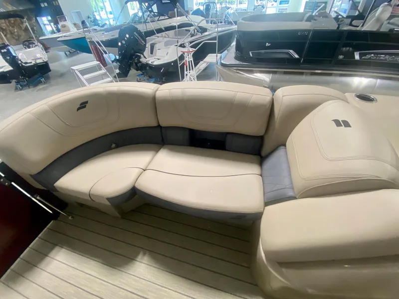 Slide: The Image of 2024 Starcraft SLS 3 Q DH boat interior seating in showroom. - 26