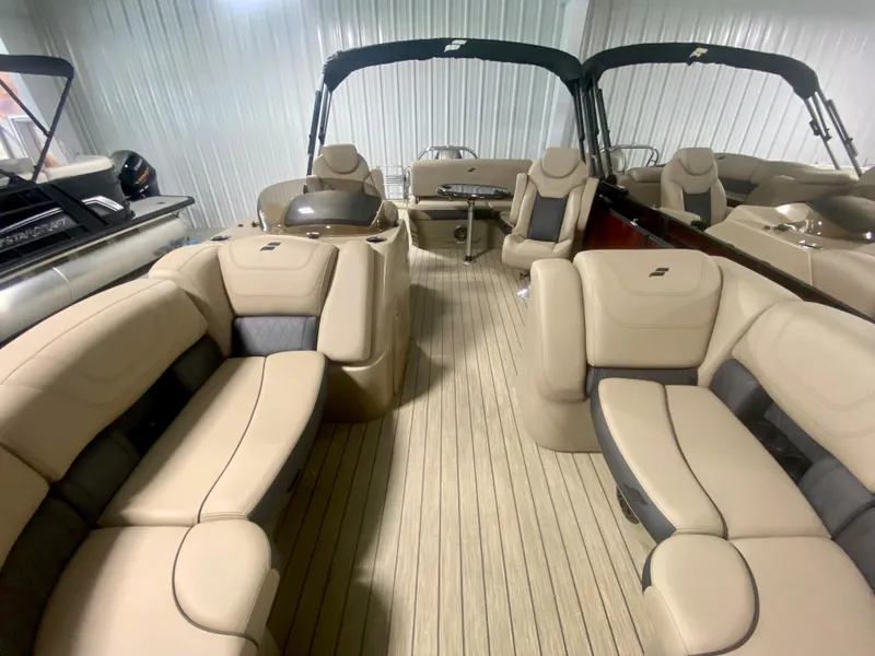 Slide: The Image of 2024 Starcraft SLS 3 Q DH pontoon boat with luxurious beige seating and spacious layout. - 33