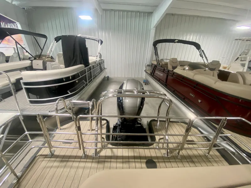 Slide: The Image of 2024 Starcraft SLS 3 Q DH pontoon boats in showroom. - 7