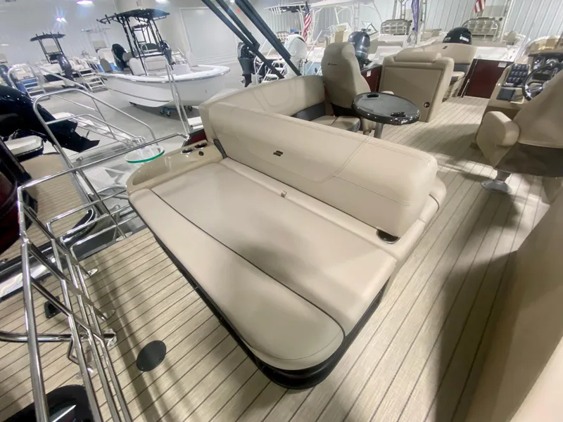 Slide: The Image of 2024 Starcraft SLS 3 Q DH boat interior with beige seating and wooden flooring. - 8
