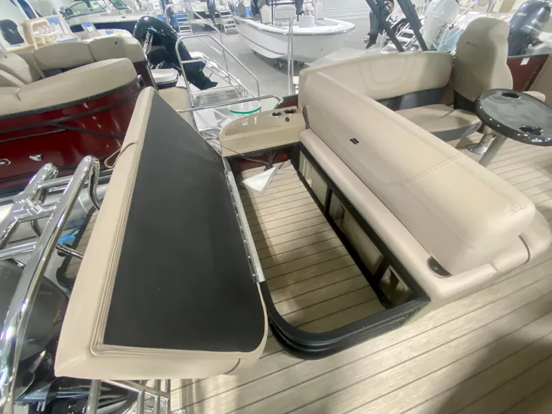 Slide: The Image of 2024 Starcraft SLS 3 Q DH boat interior with beige seating and black table. - 9