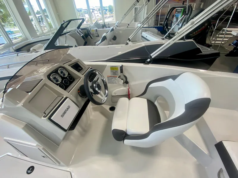 Slide: The Image of 2024 Starcraft SVX 191 boat interior with steering wheel and dashboard. - 10