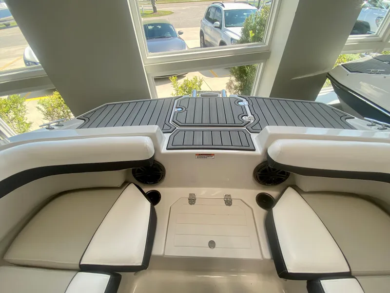 Slide: The Image of 2024 Starcraft SVX 191 boat interior with cushioned seating and deck. - 20