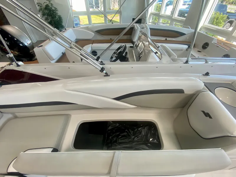 Slide: The Image of 2024 Starcraft SVX 191 boat interior with seating and storage compartments. - 9