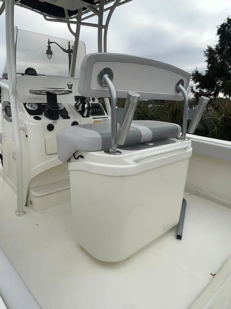 Slide: The Image of 2024 Mako 214 CC center console boat interior with seating and control panel. - 7