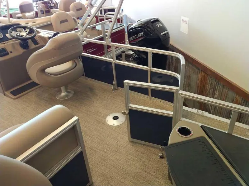 Slide: The Image of 2024 Ranger Reata 200F boat interior with seating and Mercury outboard motor. - 2