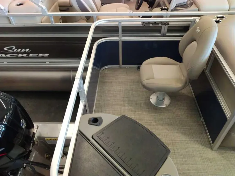 Slide: The Image of 2024 Ranger Reata 200F boat interior with seating and control panel. - 6