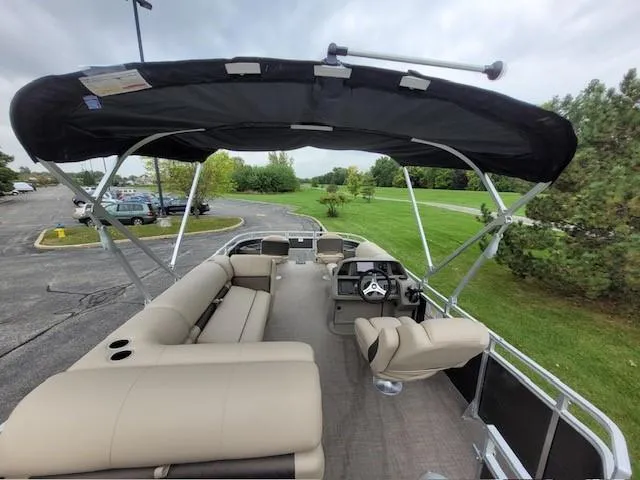 Slide: The Image of 2024 Sun Tracker Fishin' Barge 20 DLX pontoon boat with spacious seating and canopy. - 4
