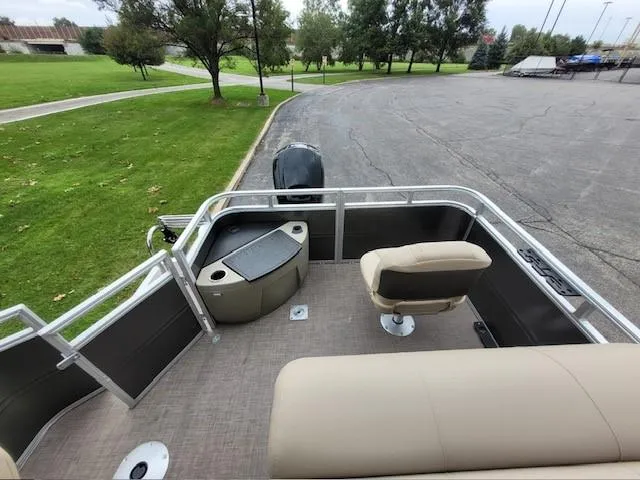Slide: The Image of 2024 Sun Tracker Fishin' Barge 20 DLX pontoon boat with seating and storage. - 5