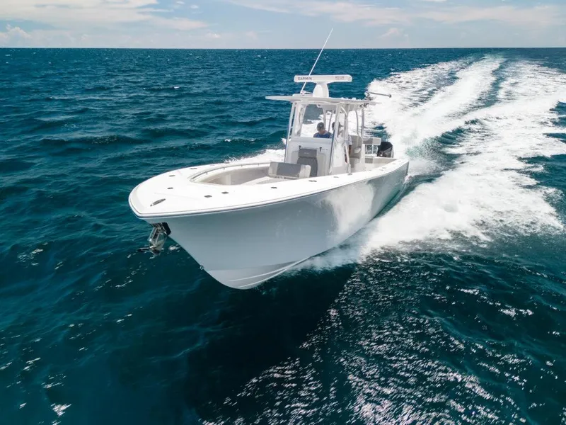 Slide: The Image of 2025 Front Runner 33 CC Custom boat cruising on open ocean waters. - 10