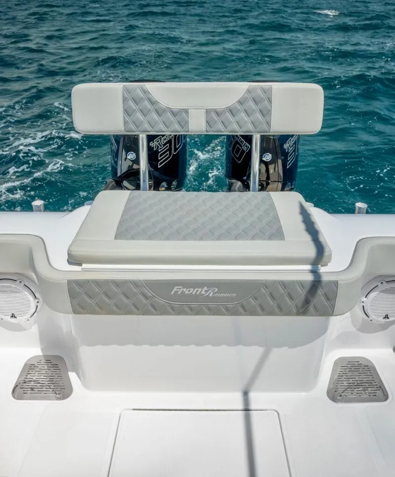 Slide: The Image of 2025 Front Runner 33 CC Custom boat, rear seating, ocean backdrop. - 5