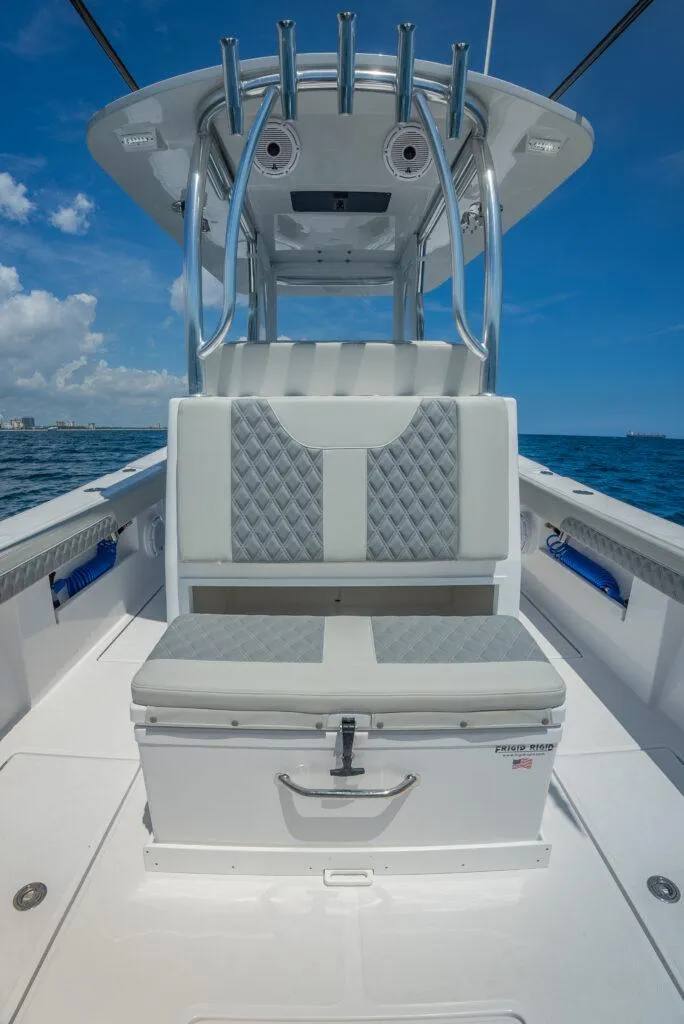 Slide: The Image of 2025 Front Runner 33 CC Custom boat interior with cushioned seating and ocean backdrop. - 7