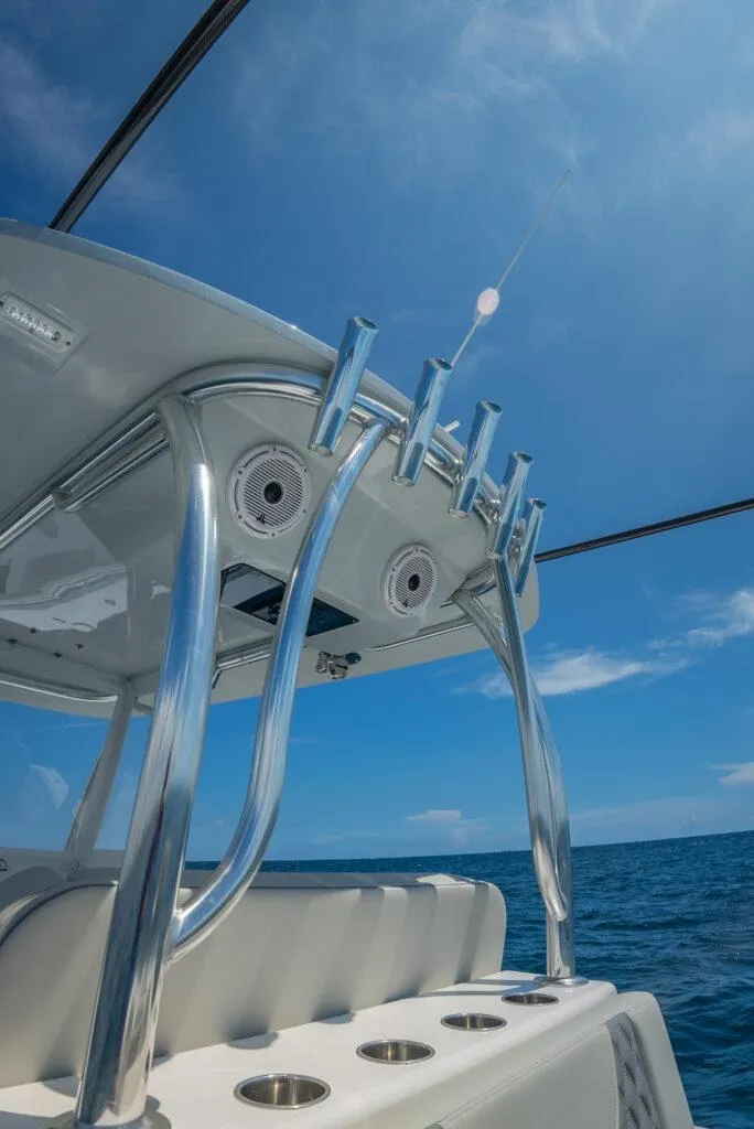 Slide: The Image of 2025 Front Runner 33 CC Custom boat, sleek design, stainless steel features, ocean backdrop. - 8