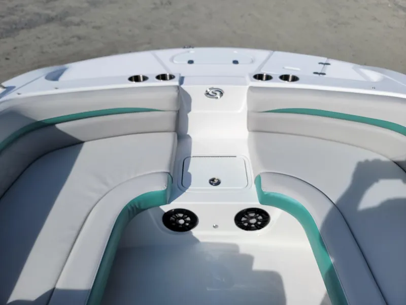 Slide: The Image of 2024 Hurricane SunDeck Sport 192 RL OB boat interior with cushioned seating and cup holders. - 10